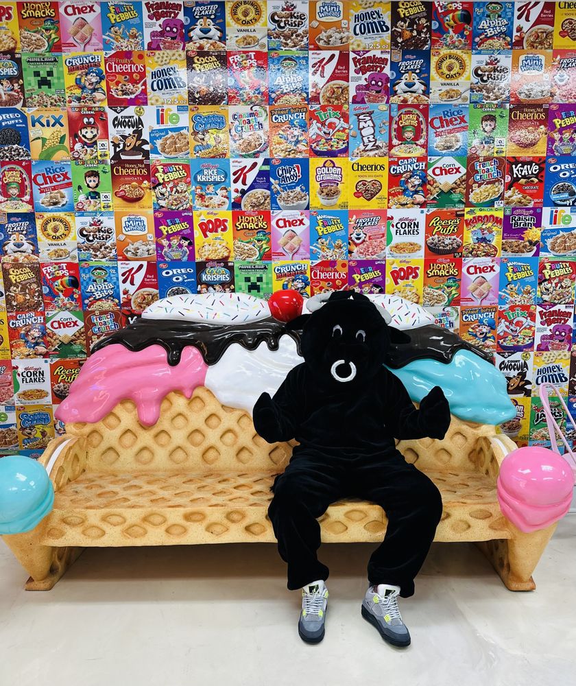 Twisted Spoons mascot on the ice-cream bench